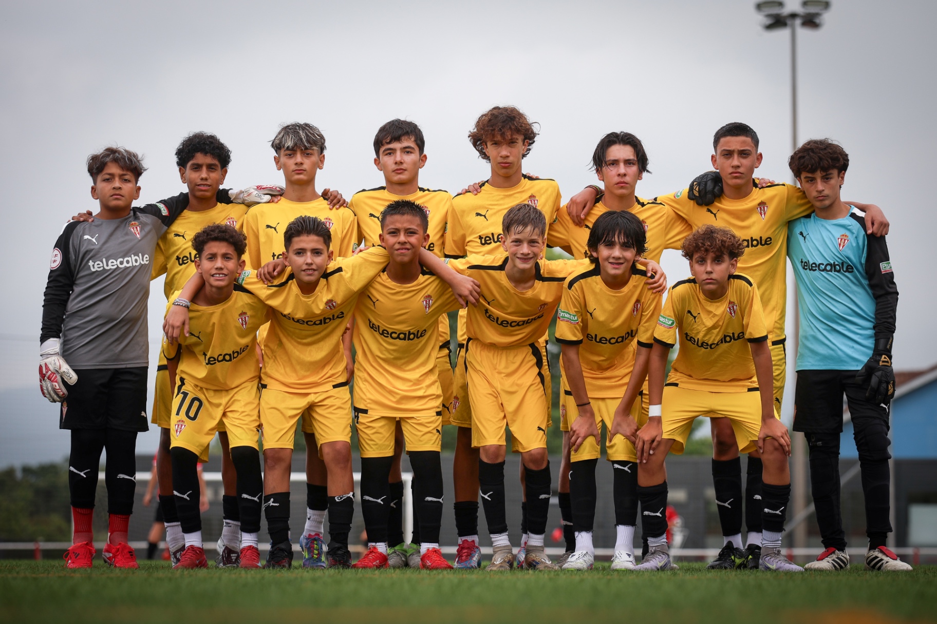 FFS players in Real Sporting de Gijón kit lined up as a squad before a match