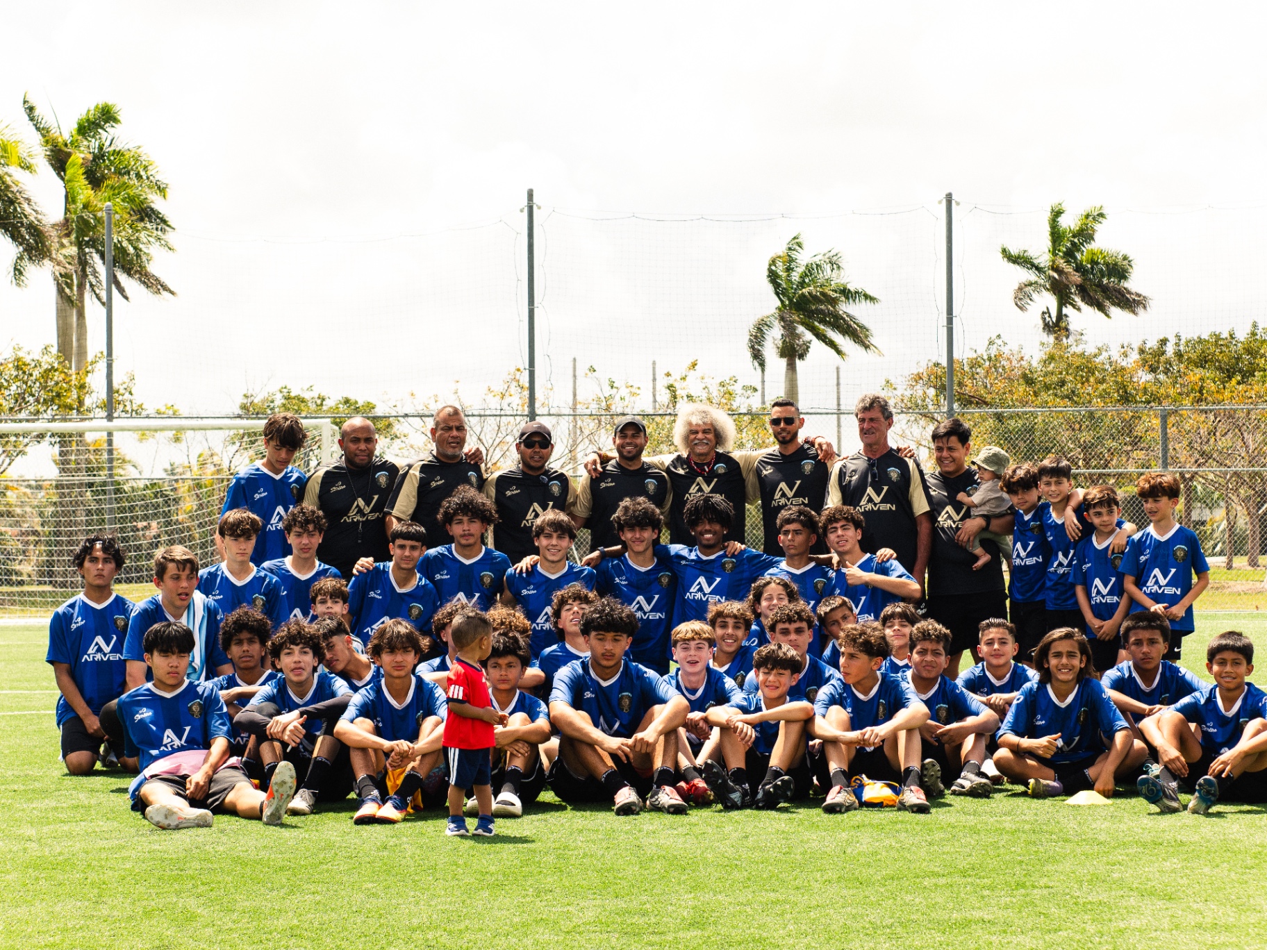 Full camp group photo with Mario Kempes and the coaching staff