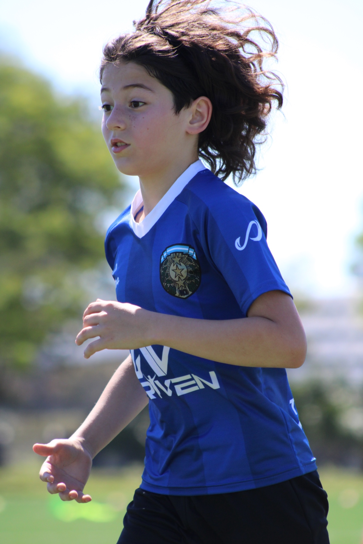 Camp player running during a training session